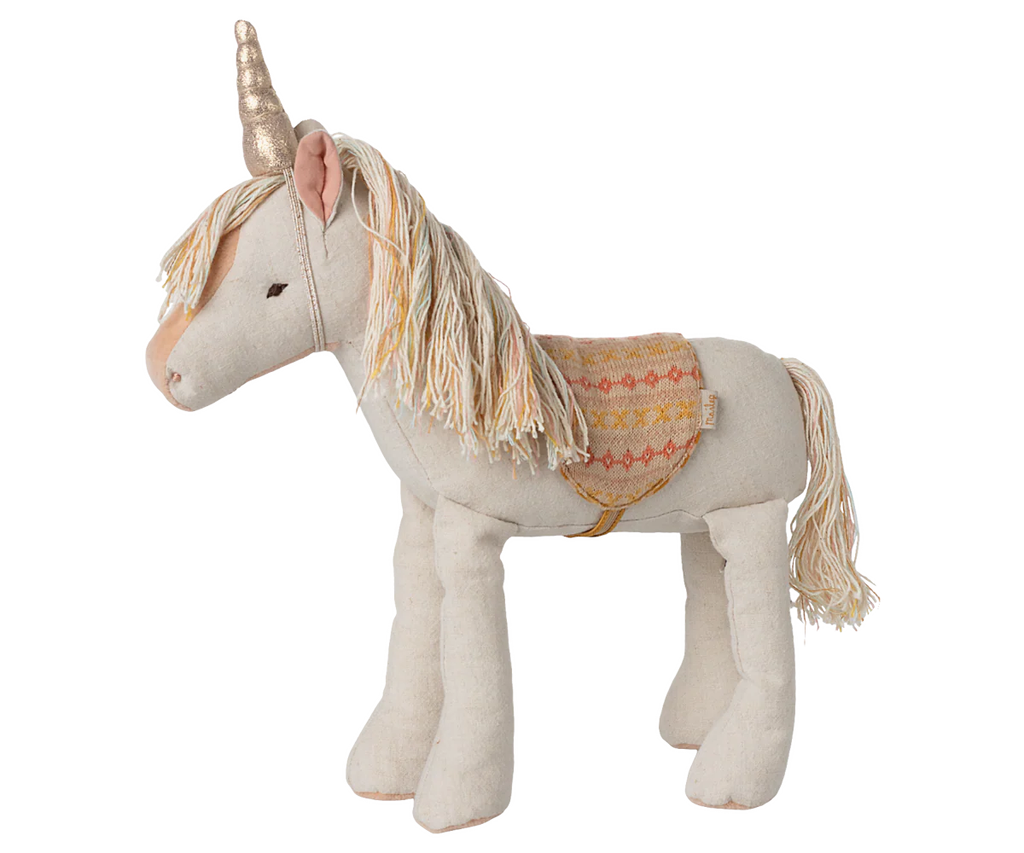 Unicorno di peluche con corno dorato e sella decorata