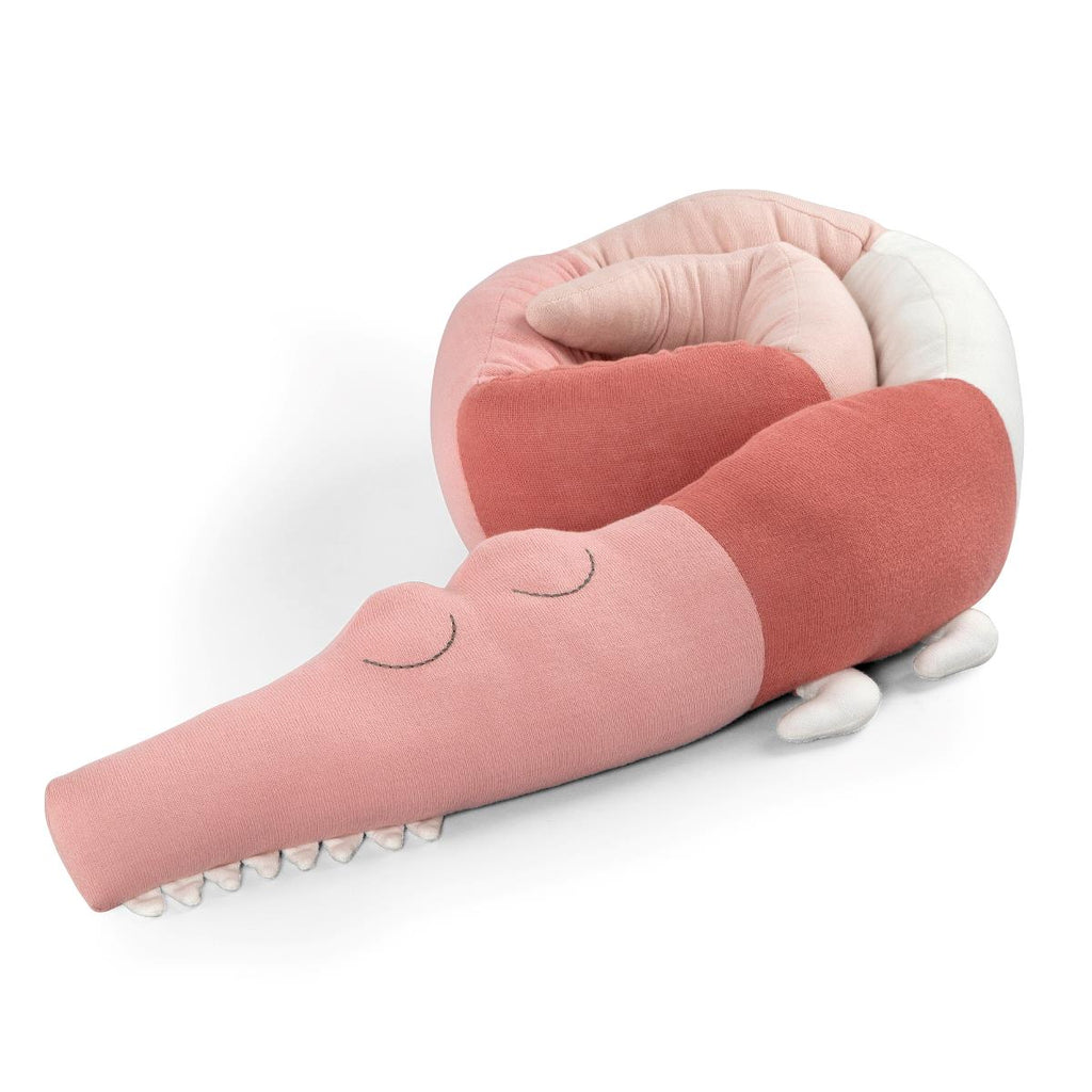 Cuscino paracolpi in stoffa sui colori rosa a forma di coccodrillo